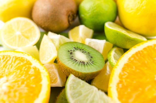 Close-up of fresh sliced citrus fruits and kiwi, showcasing vibrant colors and juicy textures.